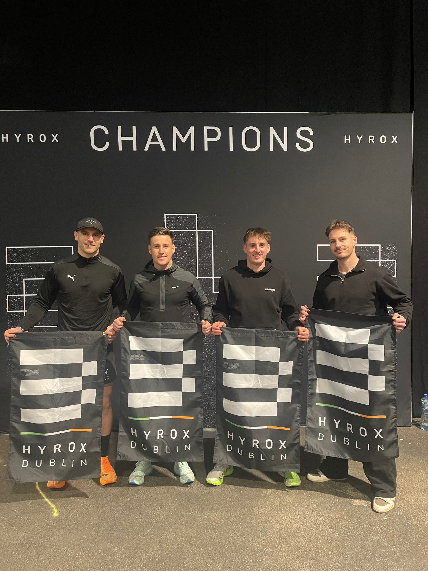 Four athletes at the HYROX Champions wall